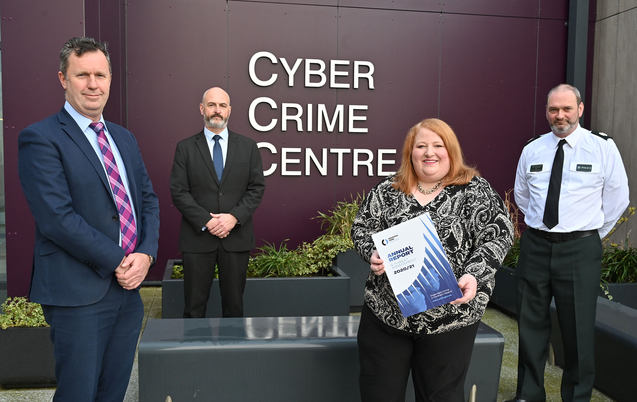 Justice Minister pictured with Cyber Crime staff