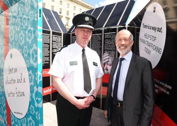 with Justice Minister David Ford is Superintendent Noel Mullan, PSNI at St George’s Market, Belfast. 