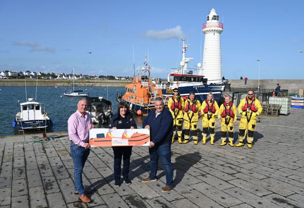 Prisoners at Maghaberry raise funds for RNLI pictured David Savage, James Carson present cheque to Ann Couser