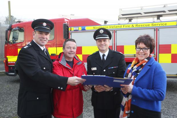 A Road Safety Agreement, delivering an education programme by emergency services, has been put in place between Magilligan Prison and Northern Ireland Fire and Rescue Service. Pictured signing the Agreement are District Commander Andrew Russell, NIFRS