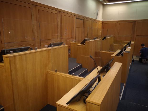 Picture of a court room with measures in place to reduce the risk of covid