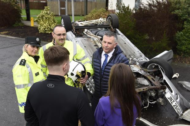 Pictured with Governor Milling (centre) are PSNI Inspector Rosemary Leech, and NIFRS Fire-fighter Rory Dummigan
