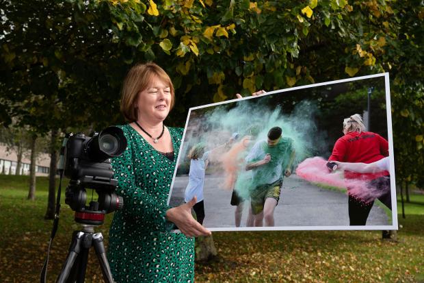 Beverley Wall, Director General of the Northern Ireland Prison Service, makes a final selection for a new exhibition of photographs featuring Sport in Prison