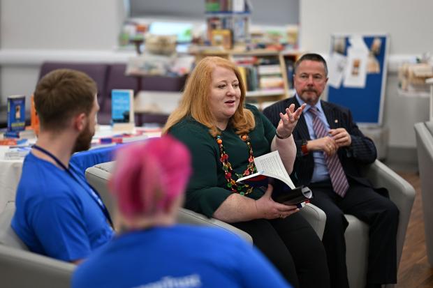 During a visit to Hydebank Wood College library to mark Book Week NI Justice Minister Naomi Long met young people in custody who have benefited from the work of Shannon Trust, a charitable organisation delivering literacy and numeracy programmes in prisons.